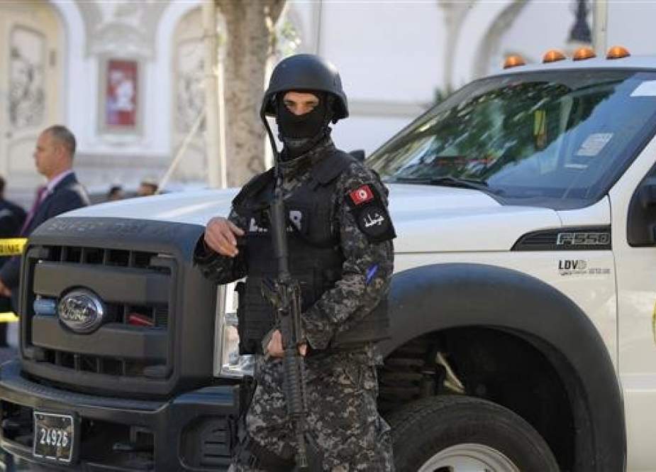 This file photo shows a member of the Tunisian security forces standing guard at the site of an attack in the Tunisian capital, Tunis, on October 29, 2019. (Photo by AFP)