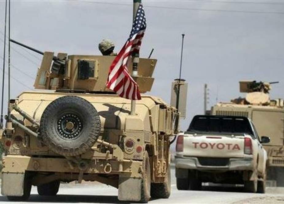 US flag flutters on a military vehicle in Manbij countryside, Syria.jpg