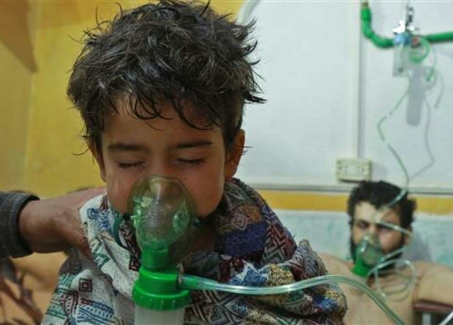Syrian children and adults receive treatment for a suspected chemical attack.jpg