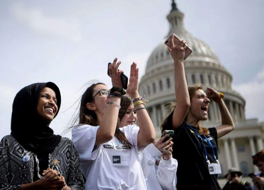 US Representative Ilhan Omar (L) attends a Youth Climate Strike on March 15, 2019 on the West Front of the US Capitol in Washington DC. (Getty Images)