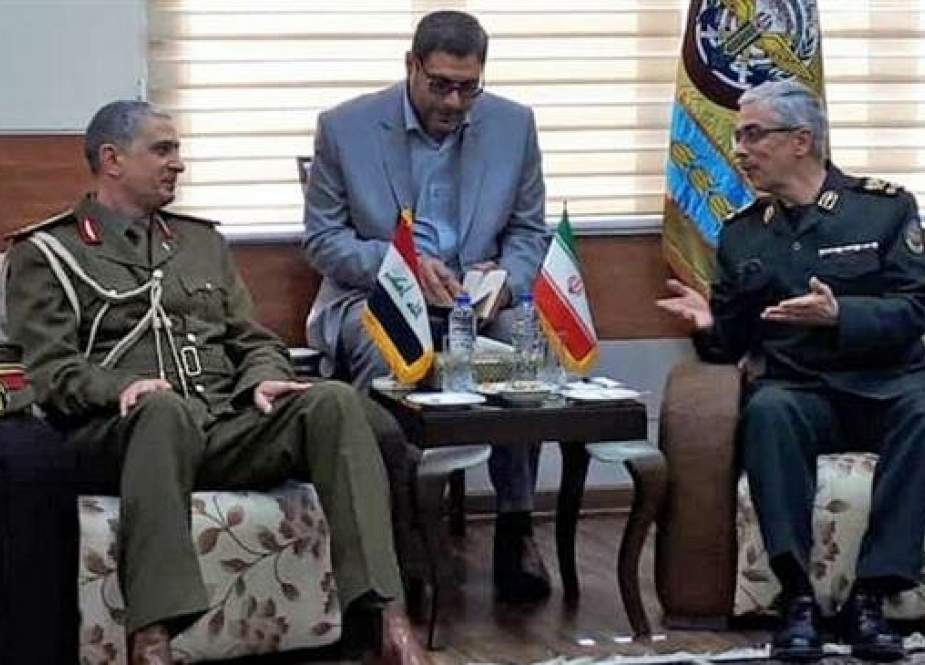 A photo provided by IRNA on April 7, 2019 shows Chairman of the Chiefs of Staff of the Iranian Armed Forces Major General Mohammad Baqeri (R) and his Iraqi counterpart, Lieutenant General Othman al-Ghanimi, in Tehran.