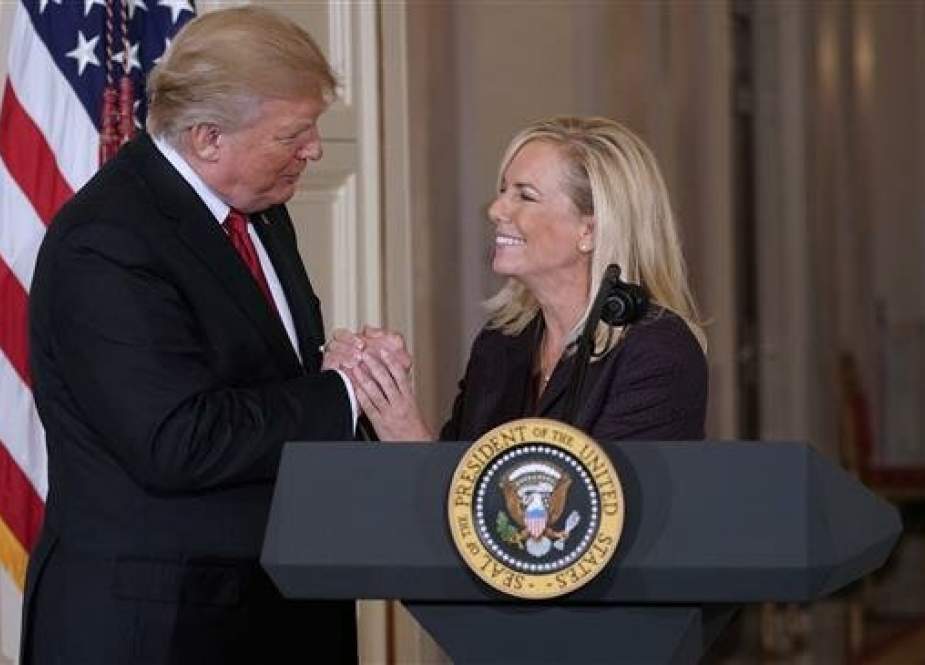 In this AFP file photo taken on October 12, 2017, US President Donald Trump clasps hands with Kirstjen Nielsen after nominating her to be the next Homeland Security Secretary in the East Room of the White House in Washington, DC.