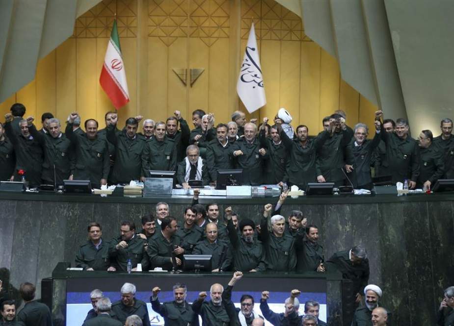 Iranian lawmakers - all wearing IRGC uniforms in support of the force - at the parliament in Tehran on April 9, 2019.