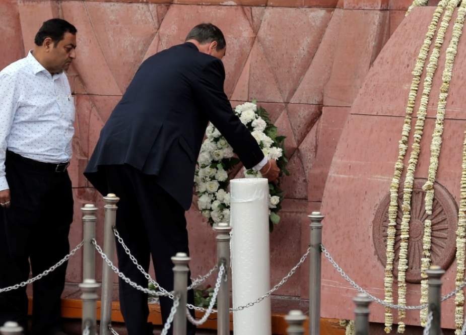 British High Commissioner to India Dominic Asquith (C) lays a wreath in tribute on the 100th anniversary of the Jallianwala Bagh massacre at the Jallianwala Bagh martyrs memorial in Amritsar on April 13, 2019. (Photo by AFP)