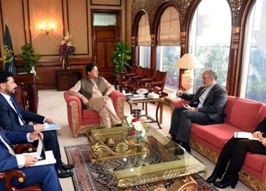 Iranian Ambassador to Islamabad Mahdi Honardoost (2nd, R) meets with Pakistani Prime Minister Imran Khan (C) on April 18, 2019, a few days before the latter