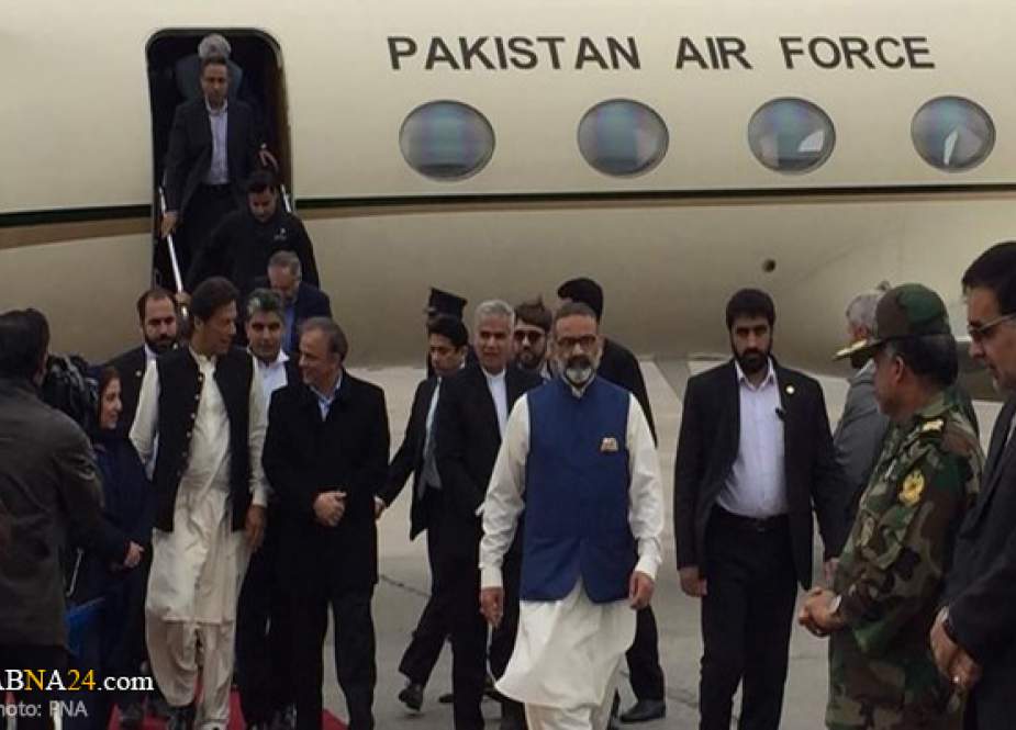 Pakistani Prime Minister Imran Khan, center, and his accompanying delegation arrive in the northeastern Iranian city of Mashhad on April 21, 2019.