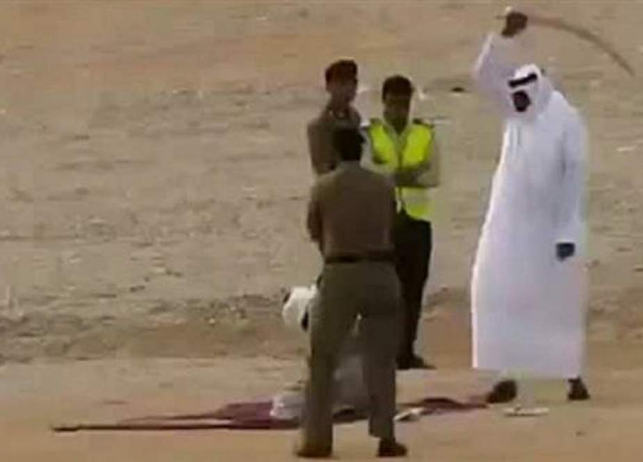 This file picture shows a man kneeling before being beheaded in Saudi Arabia.