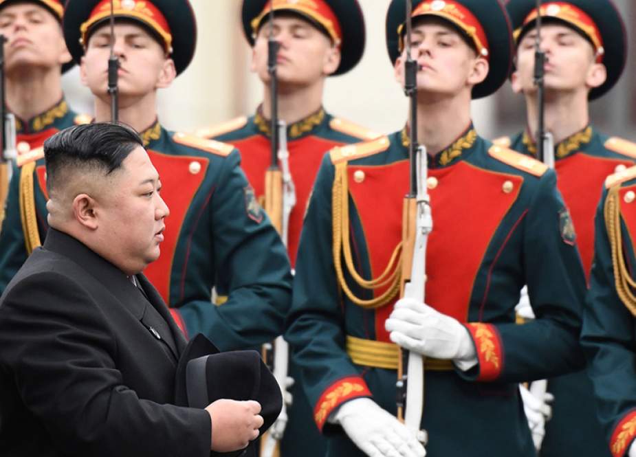 North Korean leader Kim Jong-un walks past honor guards during a welcoming ceremony on arrival at the railway station in the Far Eastern Russian port of Vladivostok, on April 24, 2019. (Photo by AFP)