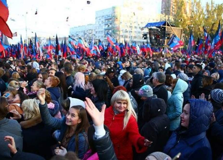 In this file photo taken on November 9, 2018, supporters of Denis Pushilin, the then-acting leader of the self-proclaimed pro-Russia Donetsk Republic, wait for him during a rally in Donetsk. (Photo by AFP)