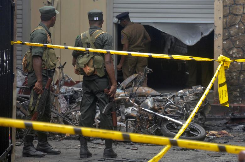 Sri Lankan military stand guard near the explosion site at a church in Batticaloa, April 21