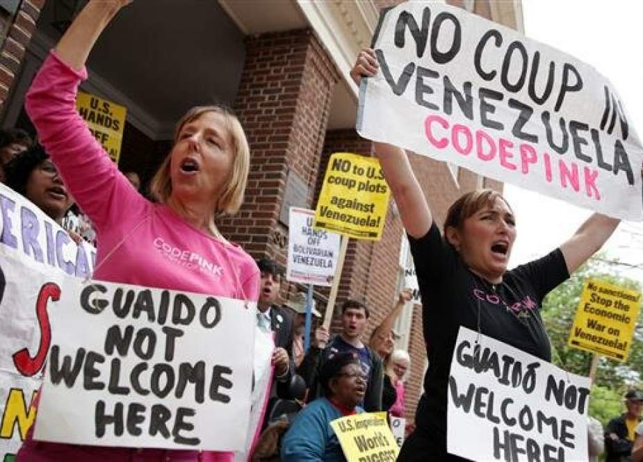 Medea Benjamin (L) and Ariel Gold (R) of CodePink shout slogans during a news conference outside the Embassy of Venezuela April 25, 2019 in Washington, DC. (Getty Images)