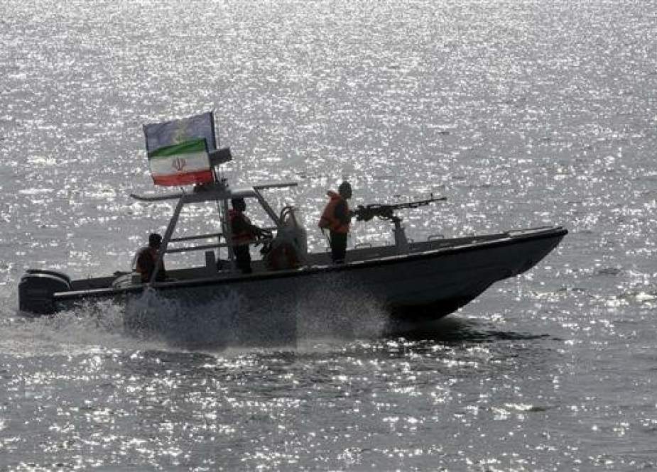 In this July 2, 2012 file photo, an Iranian IRGC speedboat escorts a passenger ship, unseen, near the spot where an Iranian airliner was shot down by a US warship 24 years ago killing 290 passengers. (Photo by AP)