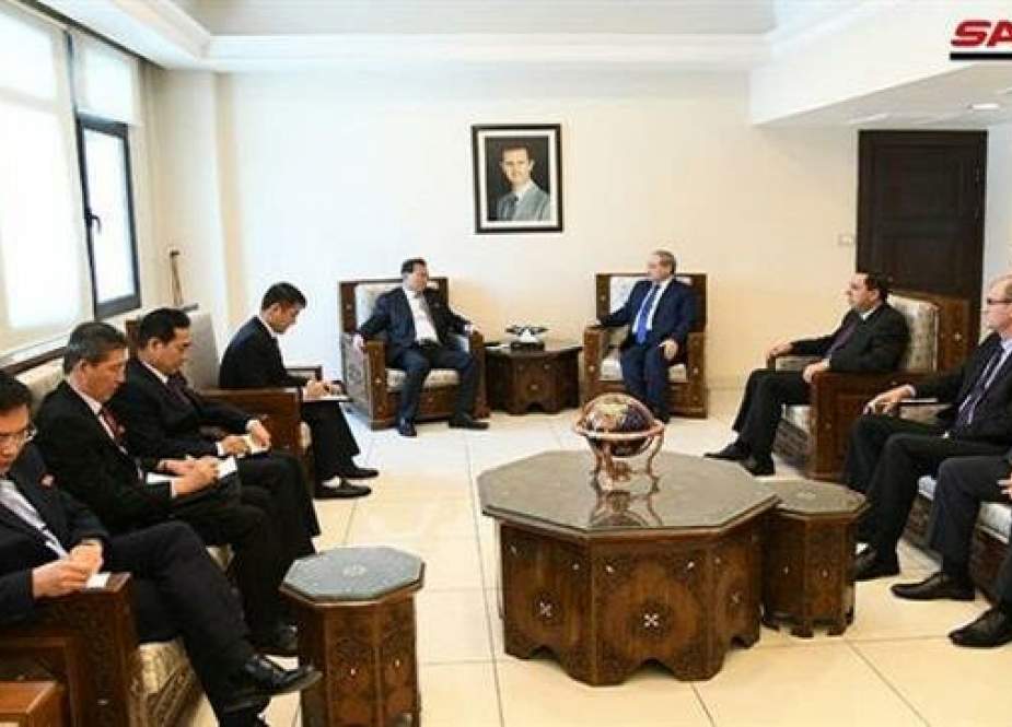 Syrian Deputy Foreign Minister Faisal Mekdad (C,R) meets with his North Korean counterpart Pak Myong-gu and accompanying entourage in the Syrian capital city of Damascus on May 1, 2019. (Photo by SANA)