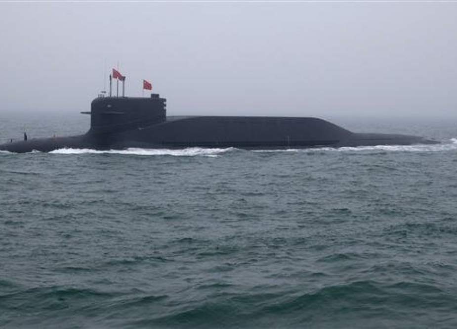 A type 094 Jin-class nuclear submarine Long March 15 of China participates in a naval parade to commemorate the 70th anniversary of the founding of China