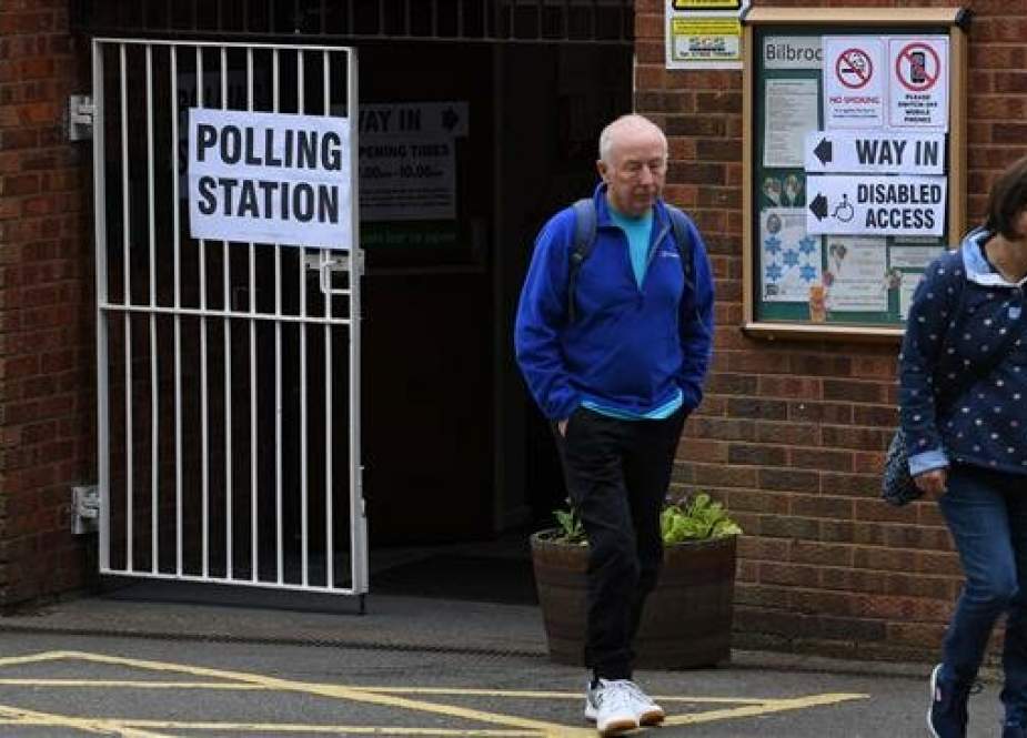 Voters leave a polling station at a community center in Featherstone, Wolverhampton, north west England as local council elections get underway on May 2, 2019. (Photo by AFP)