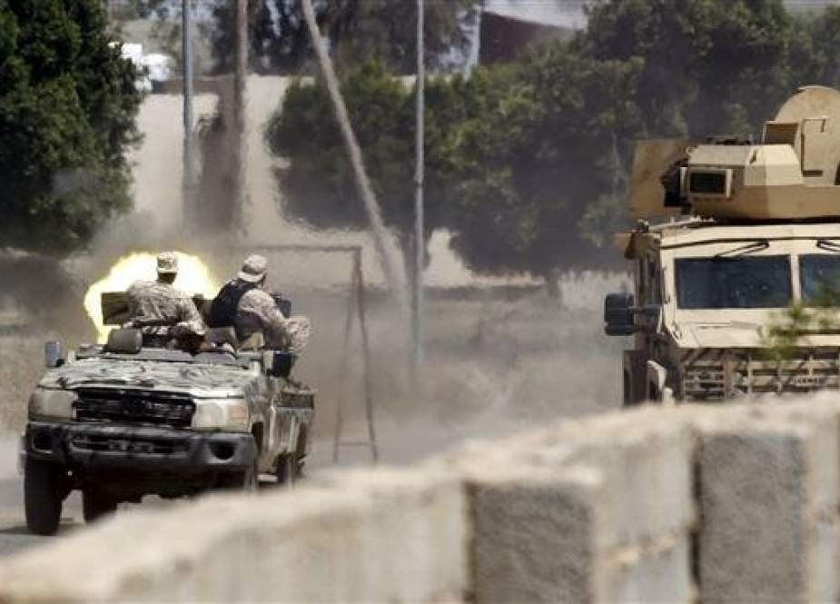 Fighters loyal to the internationally-recognized Government of National Accord (GNA) fire a jeep-mounted gun during clashes with forces loyal to strongman Khalifa Haftar, in Espiaa, about 40 kilometers south of the Libyan capital Tripoli on April 29, 2019. (Photo by AFP)