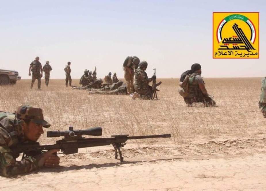 Syrian forces and Iraqi Popular Mobilization Units (PMU) forces conduct a joint operation to clear the Iraq/Syria border area of remaining Daesh terrorists on May 2, 2019. (Photo via Reuters)