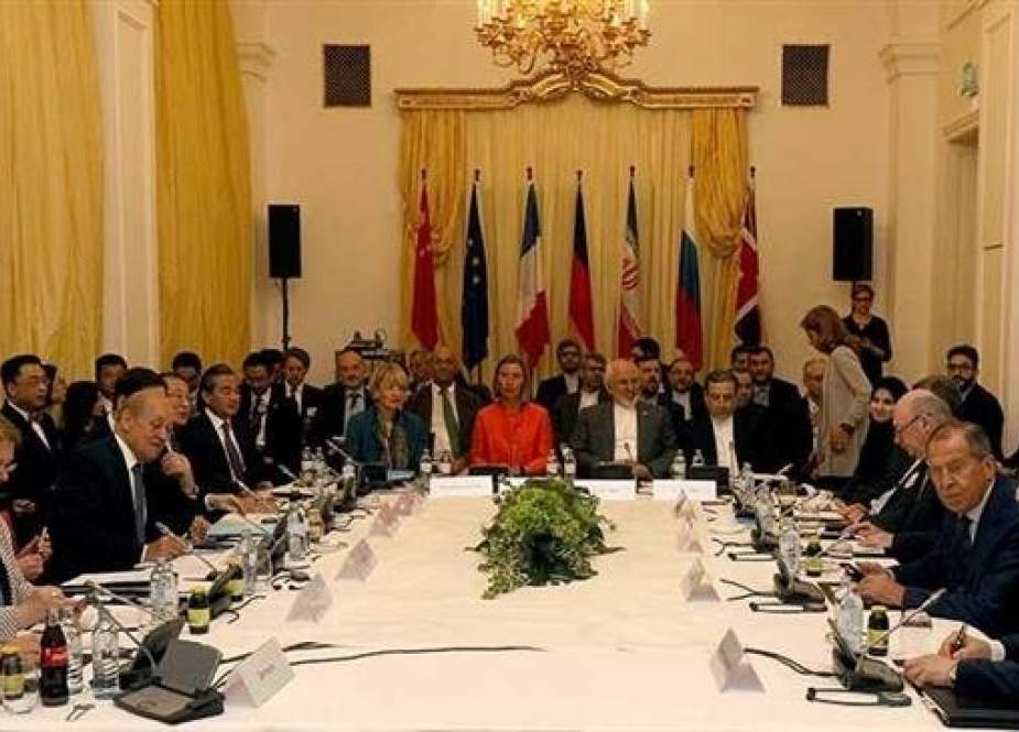 Delegates sit around a table prior to a bilateral meeting as part of the closed-door nuclear talks with Iran at a hotel in Vienna, Austria, on July 6, 2018. (Photo by AP)