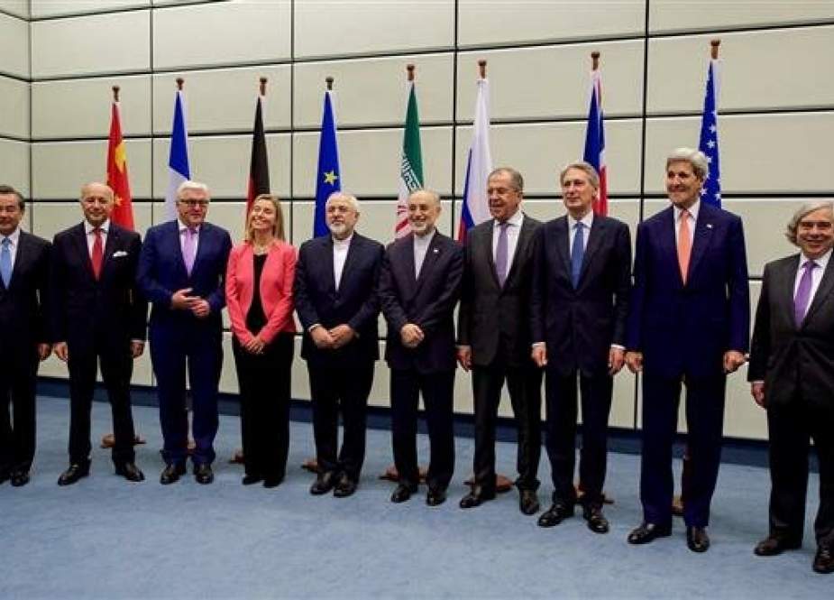 Senior diplomats of Iran and the P5+1 group of countries pose for a group picture at the United Nations building in Vienna, Austria, on July 14, 2015, after signing the nuclear deal, JCPOA.