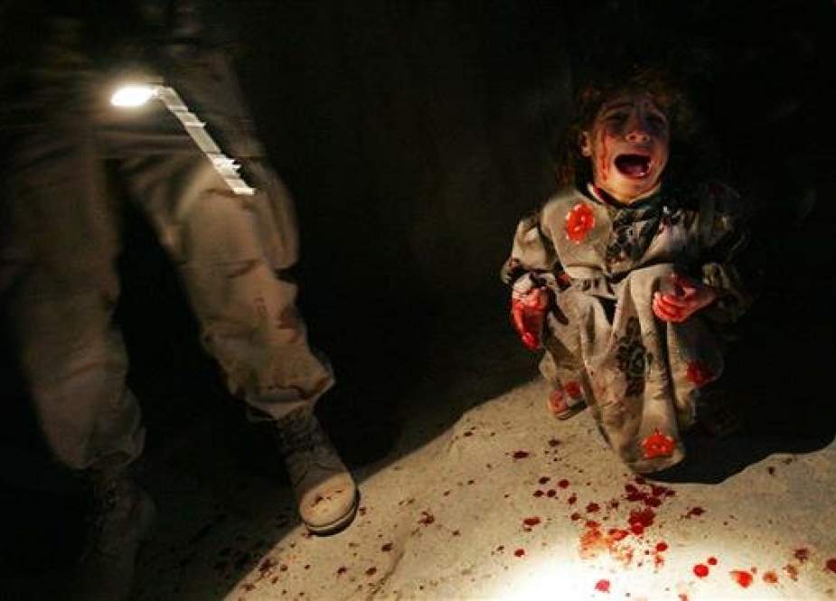 Samar Hassan, 5, screams after her parents were killed by US soldiers with the 25th Infantry Division in a shooting January 18, 2005 in Tal Afar, Iraq. (Photo via NYTimes)