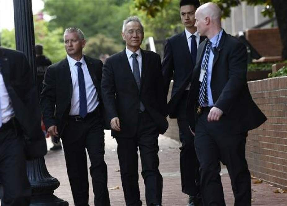 Chinese Vice Premier Liu He (C) arrives for trade talks at the Office of the United States Trade Representative in Washington.jpg