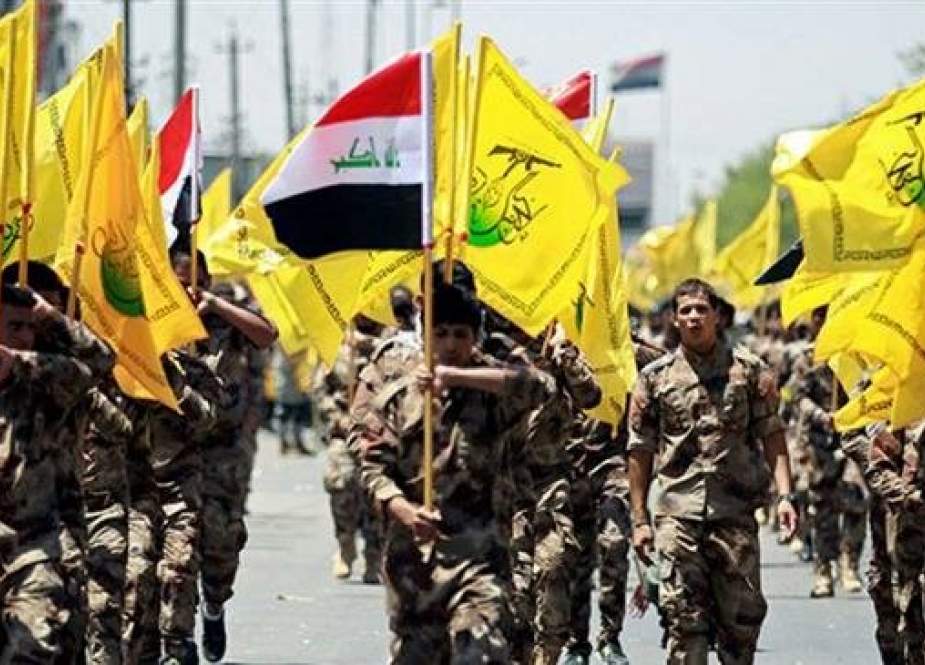 An undated image shows members of Iraq’s Harakat Hezbollah al-Nujaba, a movement known for its active cooperation with the national army in counter-terrorism operations, performing a public march.