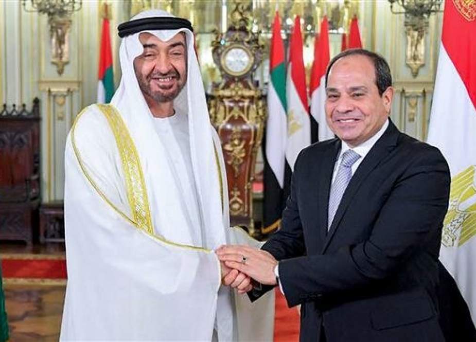 This handout picture released by the Egyptian Presidency on March 27, 2019 shows Egyptian President Abdel Fattah el-Sisi (R) welcoming Abu Dhabi Crown Prince Mohammed bin Zayed Al Nahyan in Alexandria, Egypt. (Via AFP)