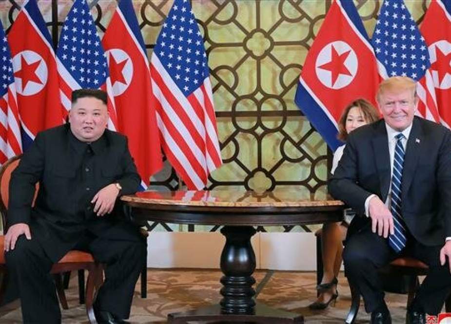 North Korean leader Kim Jong-un sitting with US President Donald Trump.jpg