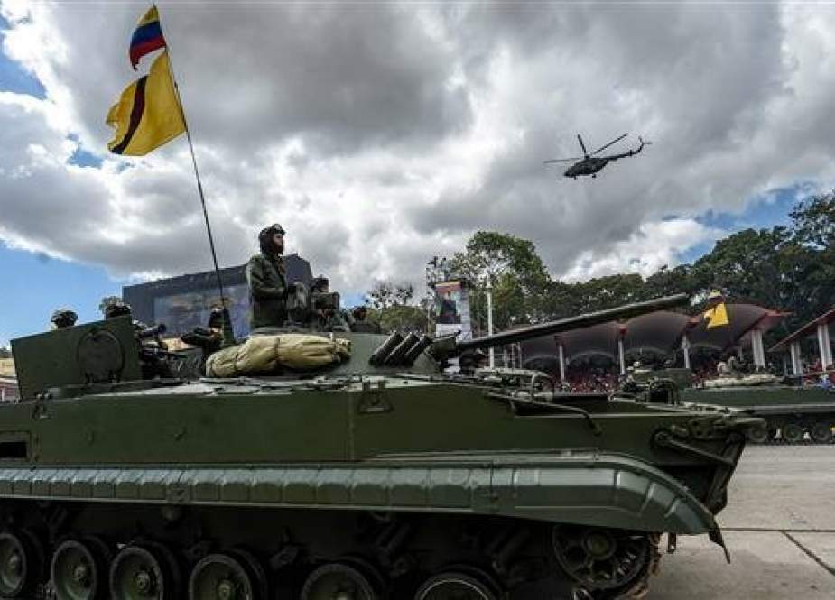 Venezuelan soldiers drive a Russian-made tank.jpg