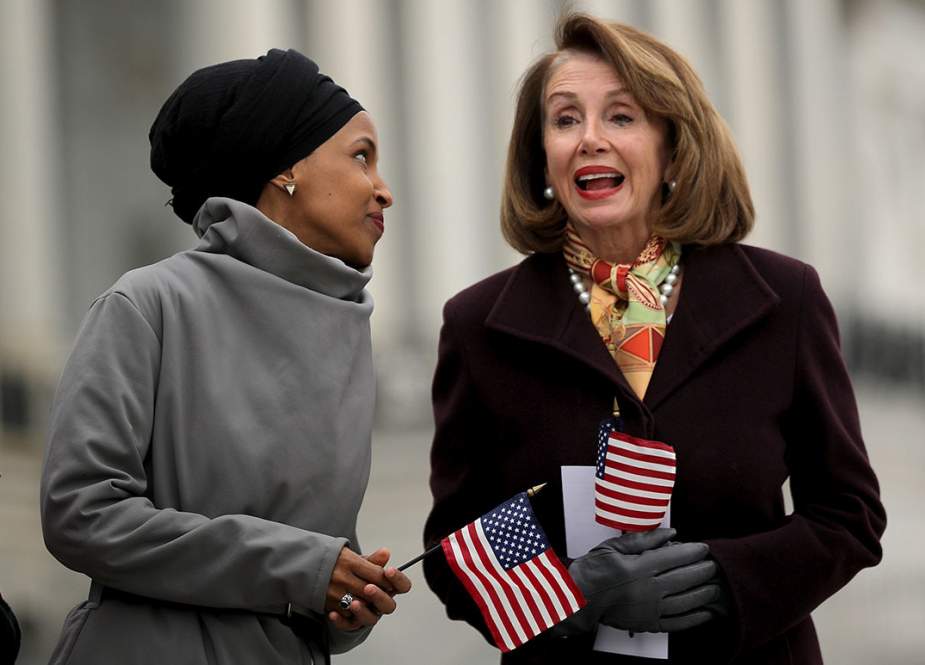 US Rep. Ilhan Omar (D-MN) (L) talks with Speaker of the House Nancy Pelosi (D-CA) during a rally with fellow Democrats before voting on H.R. 1, or the People Act, on the East Steps of the US Capitol on March 08, 2019 in Washington, DC.