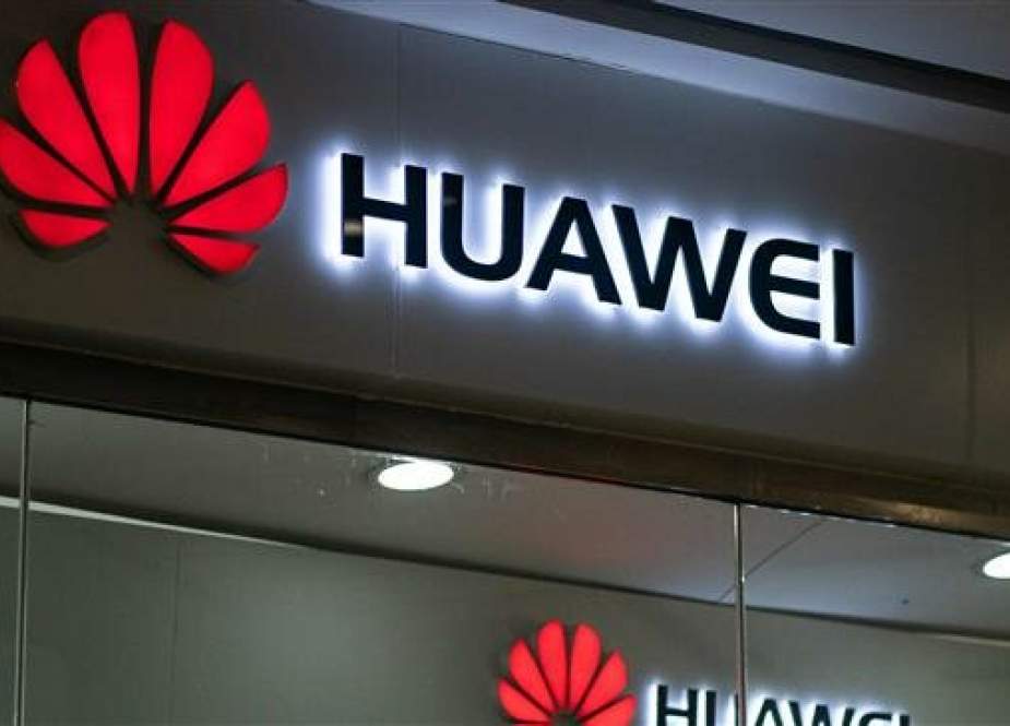 A Huawei logo is displayed at a retail store in Beijing on May 23, 2019. (Photo by AFP)