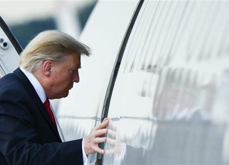 US President Donald Trump boards Air Force One at Andrews Air Force Base on May 20, 2019, as he travels to Pennsylvania for a campaign rally. (Photo by AFP)