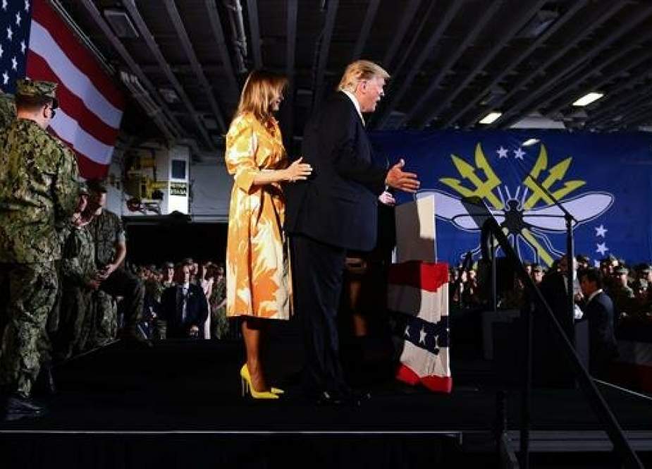US President Donald Trump and First Lady Melania Trump greets Marines during a Memorial Day event aboard the amphibious assault ship USS Wasp (LHD 1) in Yokosuka on May 28, 2019. (AFP photo)