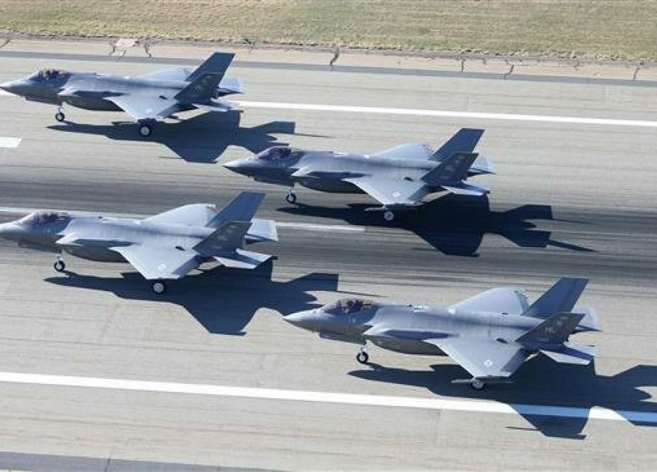 Four F-35 warplanes sit on the runway waiting for takeoff at the Hill Air Force Base, Utah on November 19, 2018. (Photo by AFP)