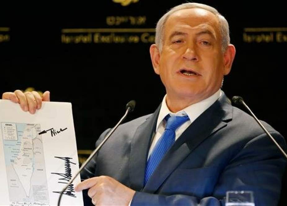 Israeli Prime Minister Benjamin Netanyahu displays a fake map of Israel that shows the occupied Syrian territories of the Golan as part of Israel, on May 30, 2019. (Photo by AFP)