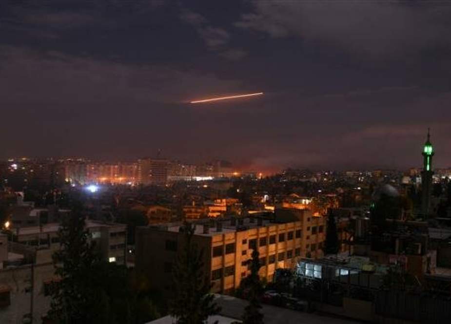 The file picture, taken on January 21, 2019, shows Syrian air defense batteries responding to Israeli missiles targeting Damascus. (By AFP)