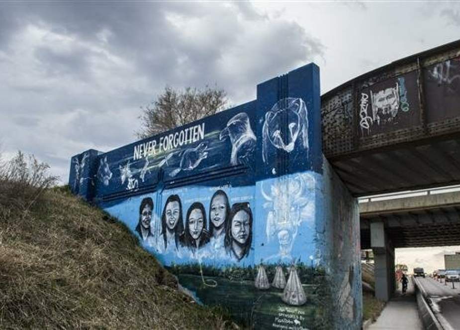 A mural honoring missing and murdered Indigenous women is erected in Winnipeg, Canada, May 13, 2019.
