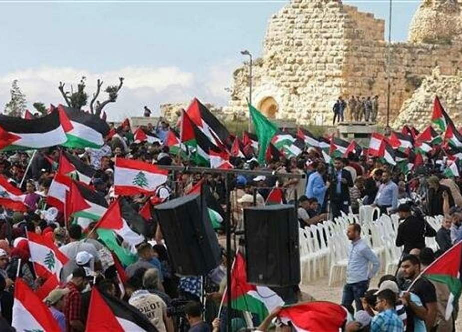 Protesters, including Lebanese nationals and Palestinian refugees, wave Palestinian and Lebanese flags during a demonstration in the medieval Beaufort Castle, known in Arabic as al-Shaqif Citadel, near Arnoun, Lebanon, May 15, 2018. (Photo by AFP)