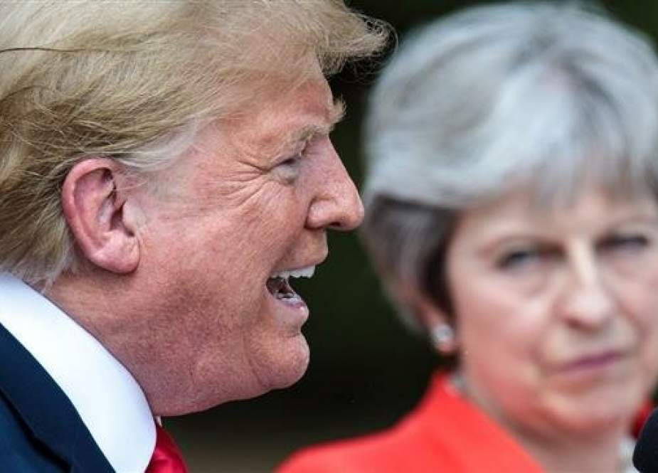 File photo shows US President Donald Trump speaking while alongside British Prime Minister Theresa May.