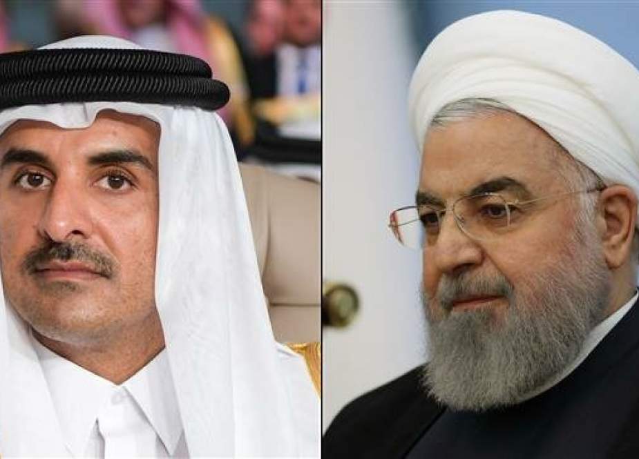 Iranian President Hassan Rouhani (R) and the emir of Qatar, Sheikh Tamim bin Hamad Al Thani