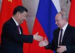 Chinese President Xi Jinping and Russian President Vladimir Putin attend a presentation of a Haval F7 SUV produced at the Haval car plant located in Russia