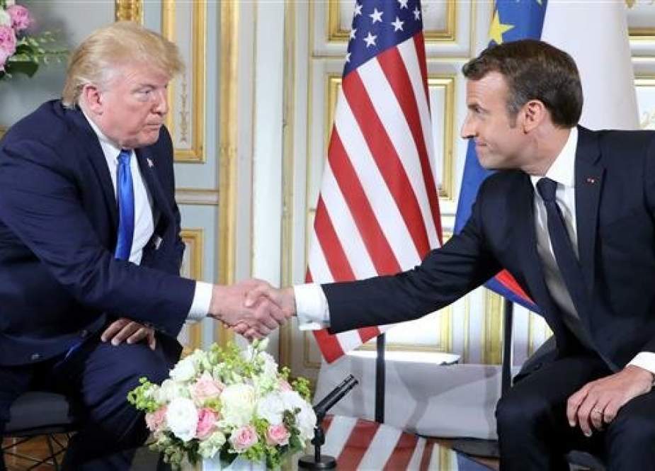 US President Donald Trump (L) and French President Emmanuel Macron shake hands during a meeting at the Prefecture of Caen, Normandy, north-western France, on June 6, 2019. (Photo by AFP)
