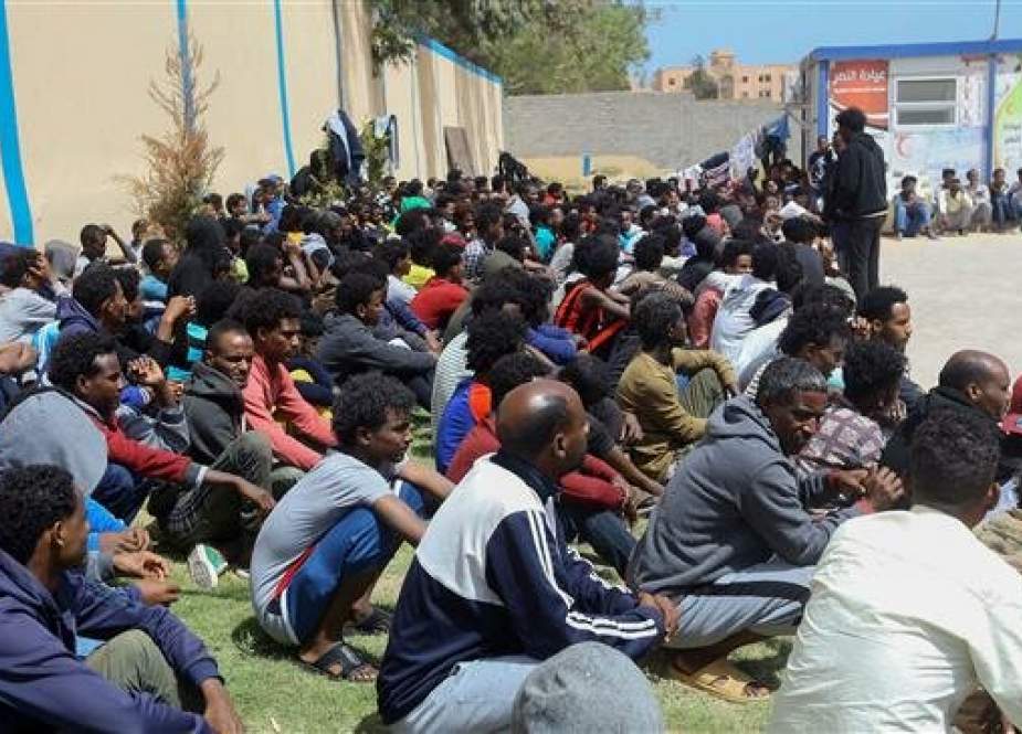 Migrants who have fled battle zones in Libya gather at a detention center in Zawiya, west of the capital, Tripoli, on April 27, 2019. (Photo by AFP)