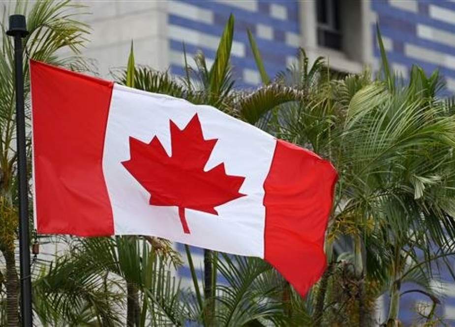 The Canadian flag flies outside the Canadian Embassy in Caracas, Venezuela, on June 3, 2019. (Photo by AFP)