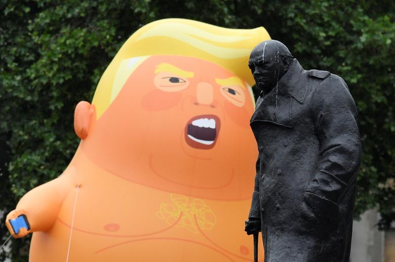 A 'Baby Trump' balloon is seen next to a statue of Winston Churchill during an anti-Trump protest in London, June 4