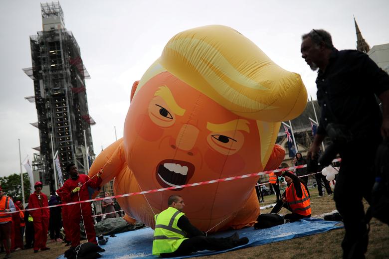 A 'Baby Trump' balloon inflates during a protest in London, June 4