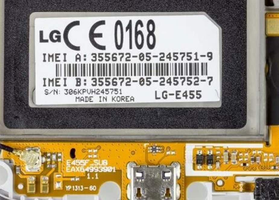 This file picture shows the IMEI number printed behind the battery pack of an LG cellphone.