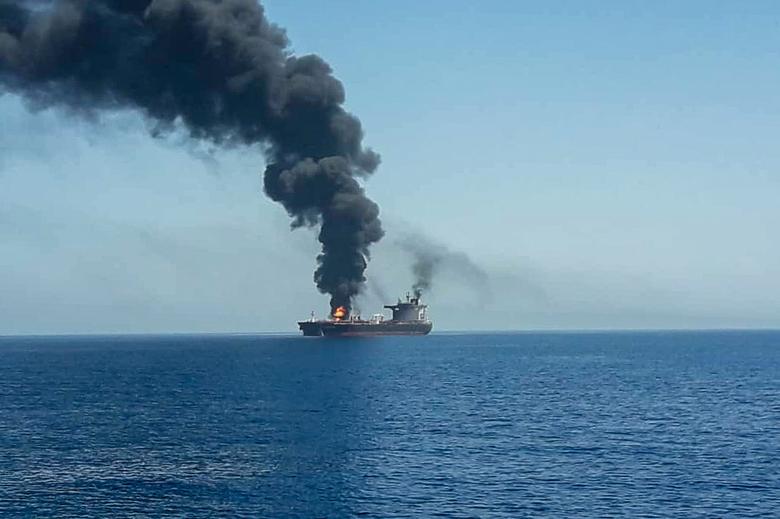An oil tanker is seen after it was attacked at the Gulf of Oman