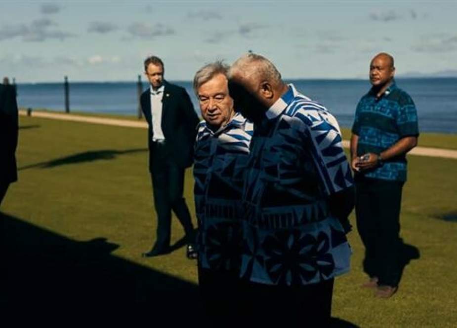 UN chief António Guterres chats with Fiji Prime Minister Frank Bainimarama in May 2019.