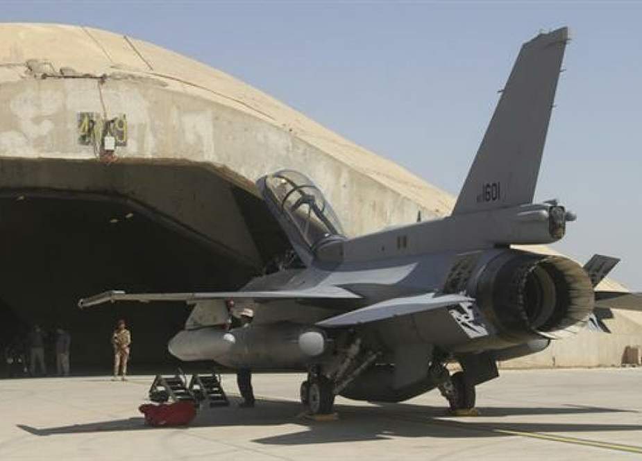 This file picture shows a US-made F-16 fighter jet outside a hardened hangar at Balad Air Base, north of Baghdad, Iraq. (Photo by The Associated Press)